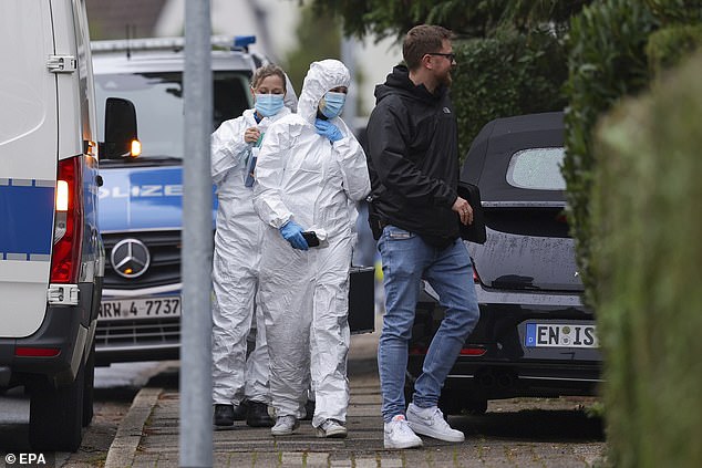 Forensic police officers seen arriving at the scene after Herdecke's newly elected Mayor Iris Stalzer was found seriously injured in a stabbing incident on October 7 2025