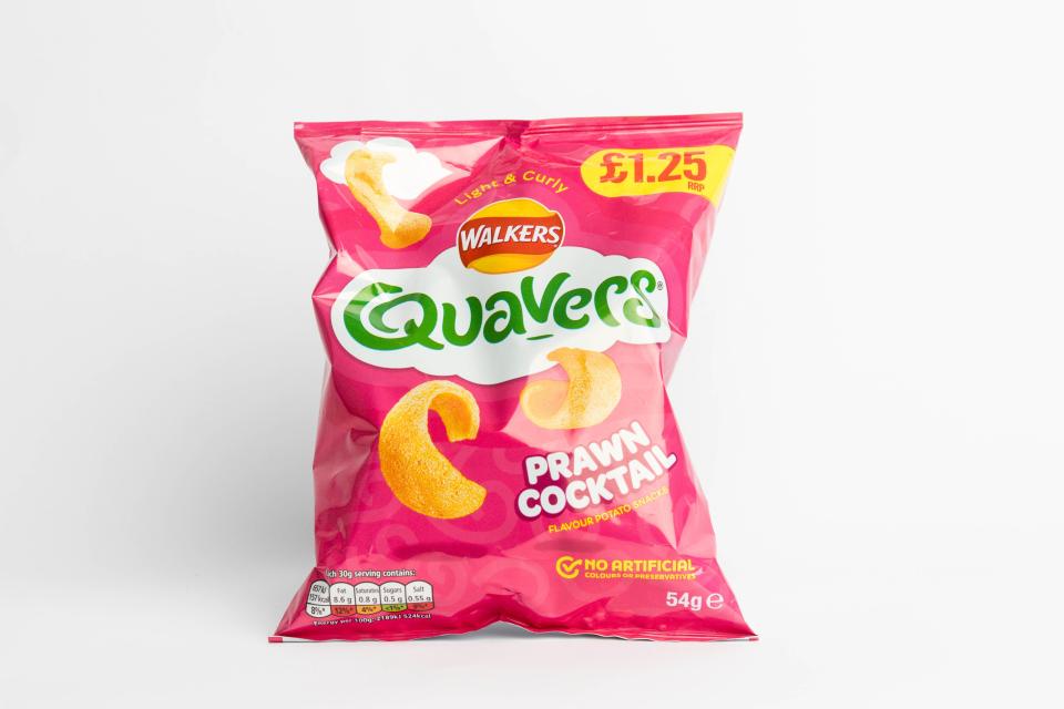 A packet of Walker's Quavers Prawn Cocktail crisps.