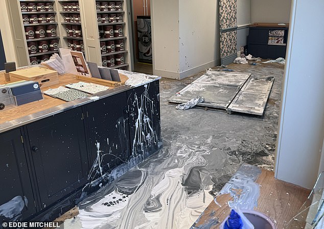 The man was then stretchered out of the shop covered in paint after a standoff with Sussex police