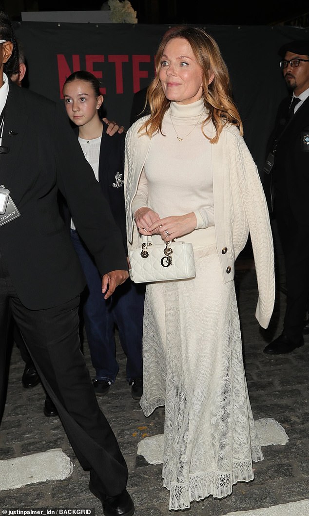 Geri - resplendent in a cream dress and matching cardigan - was joined by stepdaughter Olivia