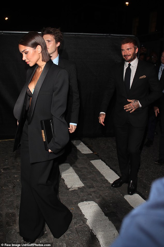 Jackie flashed her cleavage in a lace bra as she arrived at the premiere