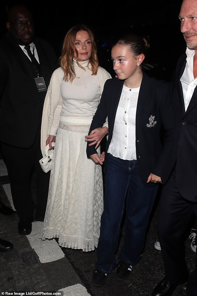 Geri linked arms with her stepdaughter as they arrived at the premiere