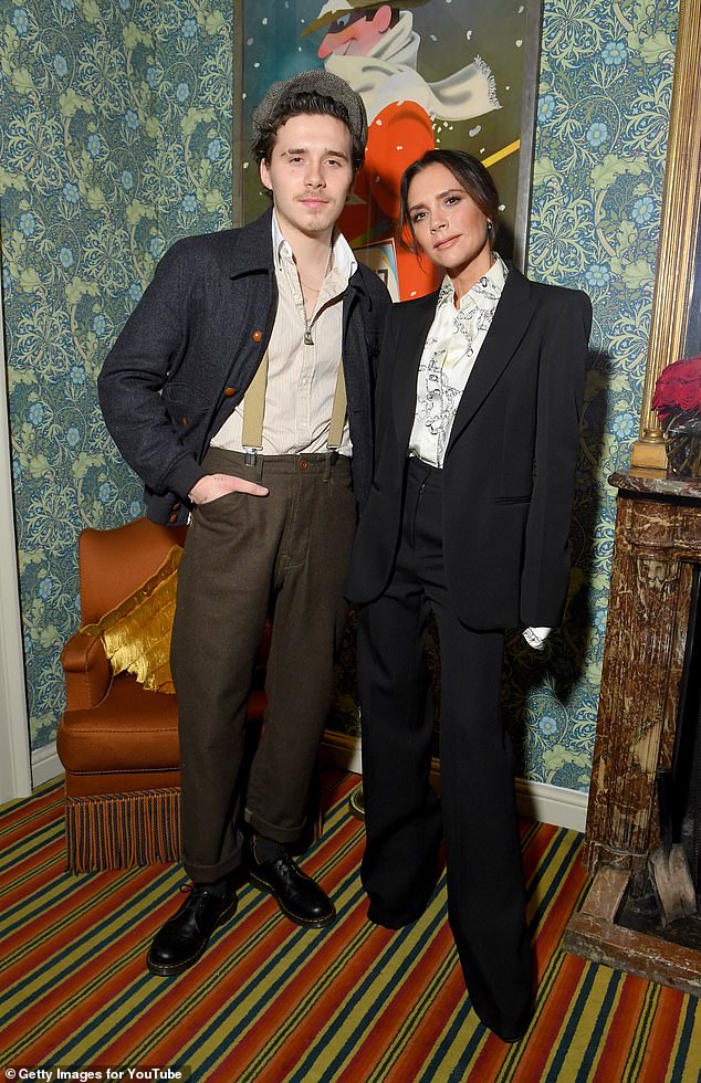 Despite Brooklyn, 26, failing to attend his mother's big night, Victoria didn't hesitate when bringing up her son at the screening on stage (pictured together in 2019)