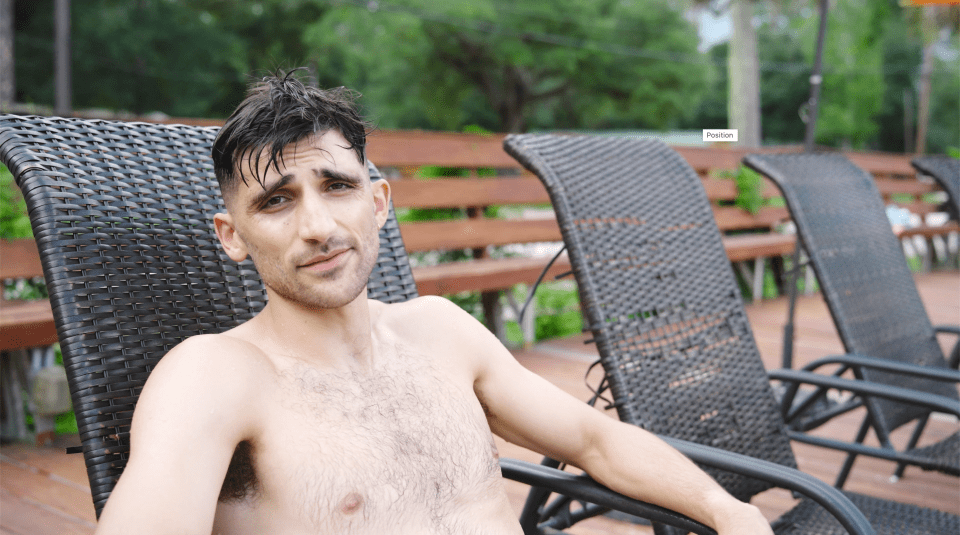 Tim Kraemer sitting on a lounge chair at Indian Hills nudist resort.