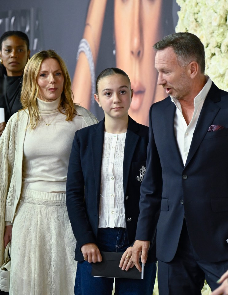 Geri Horner, Christian Horner, and a young woman at the "Victoria Beckham" World Premiere.