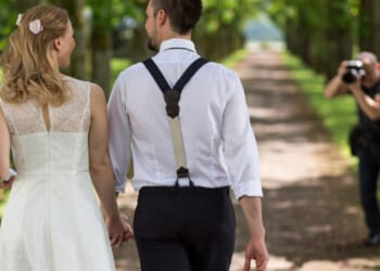 Bride left furious as her wedding photos are 'absolutely ruined' thanks to the officiant's BRA and bizarre themed dress