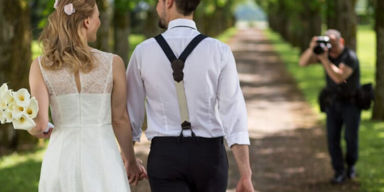 Bride left furious as her wedding photos are 'absolutely ruined' thanks to the officiant's BRA and bizarre themed dress