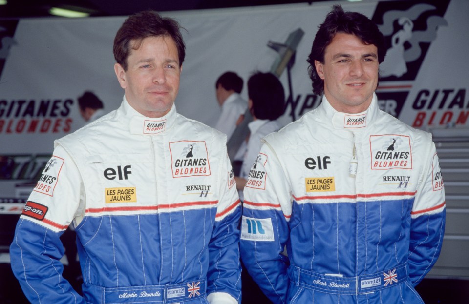 Automobile drivers Martin Brundle and Mark Blundell in their racing suits.