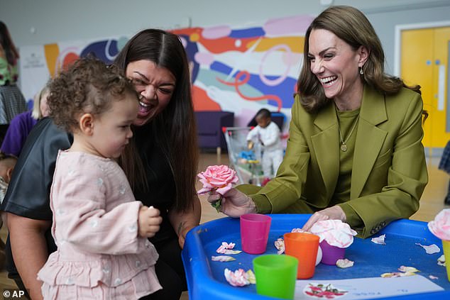 The mother-of-three smiled as she interacted with a child during the visit to Home-Start in Oxfordshire