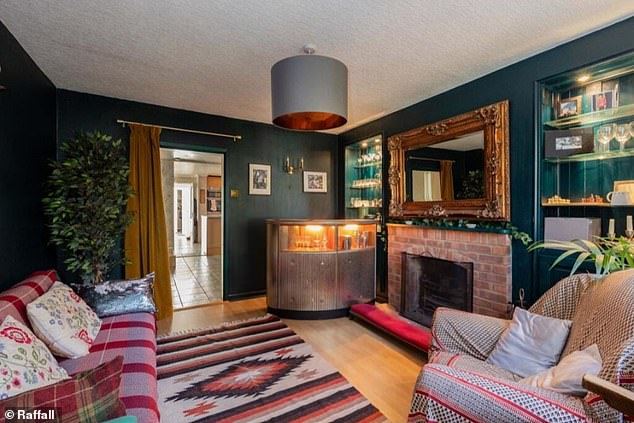 The five-bedroom home features a 'cozy' living room with its own fireplace