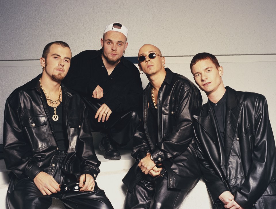 English pop group East 17, from left to right Terry Coldwell, Brian Harvey, John Hendy, and Tony Mortimer, all wearing black leather jackets.
