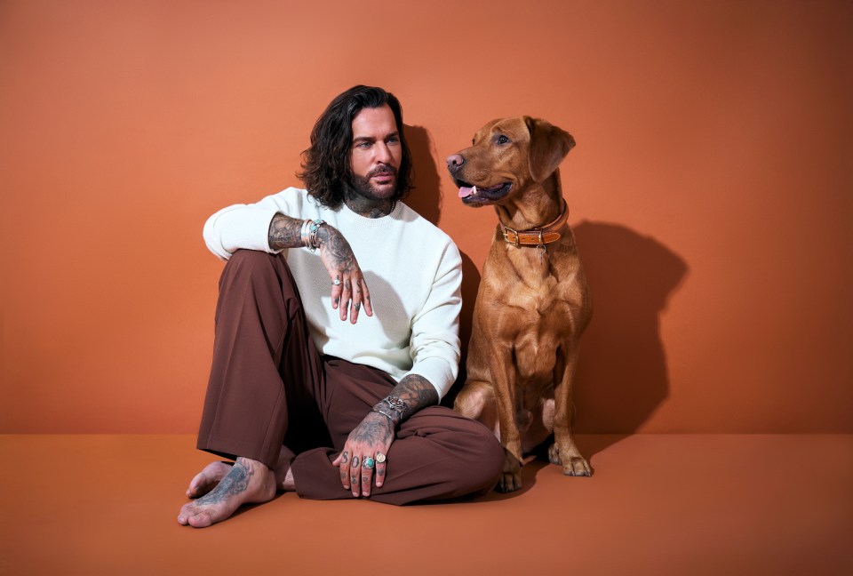 Pete Wicks and a brown dog on a brown background.