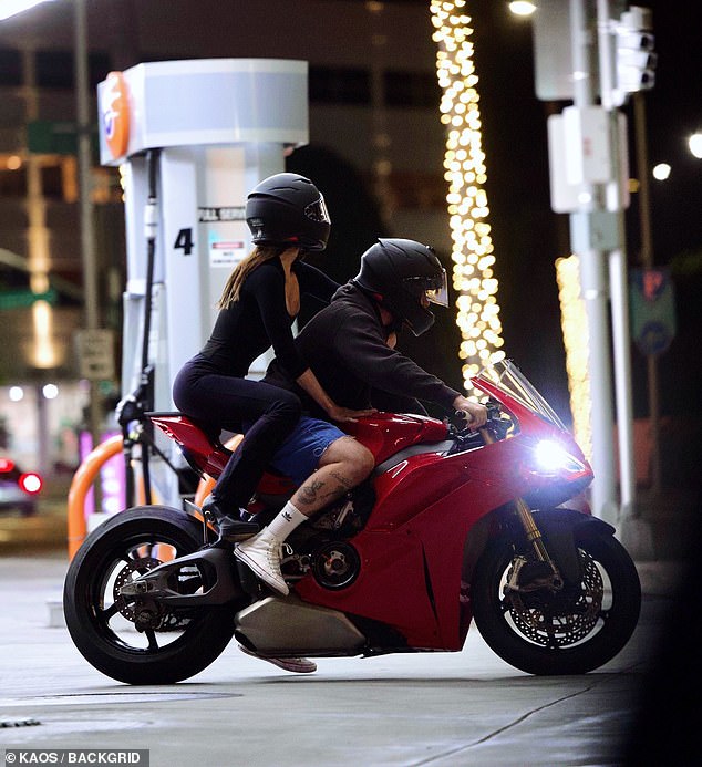 Suggesting it is very much them against the world, Nicola, 30, clung onto her man as they zoomed through the streets on a pricey red Ducati motorbike