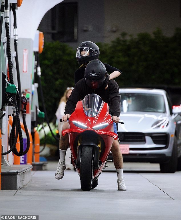 Nicola showed off her svelte frame in a tight-fitting black top and yoga pants, sporting a matching helmets with her husband