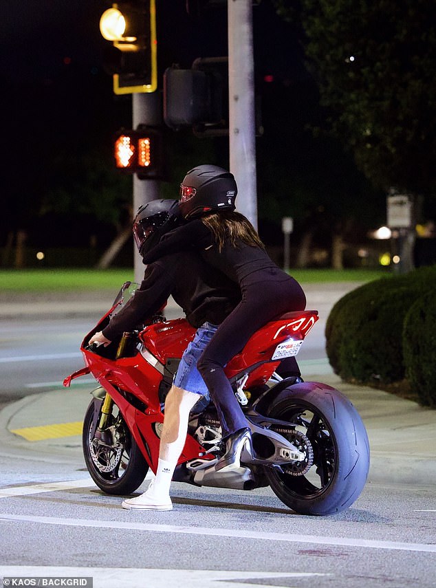 Nicola perched on the back of the bike