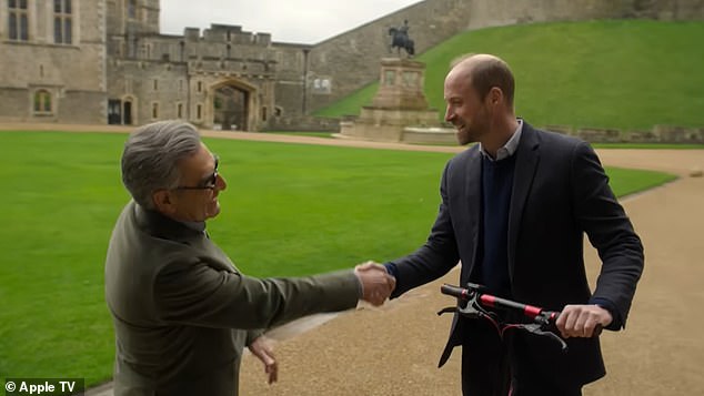 The Prince of Wales (right) showed off his motoring skills in a humorous moment that captured him whizzing around Windsor Castle at impressive speed. Pictured with Eugene Levy (left)