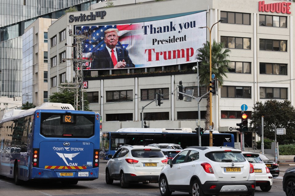 A billboard displaying an image of US President Donald Trump with the text "Thank you President Trump" on a building in Tel Aviv.