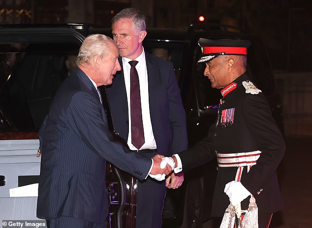 Pictured: King Charles shaking the hand of a military personele at the event