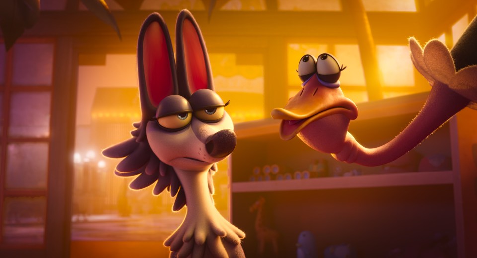 Jared Leto in a black futuristic suit with glowing red lines.