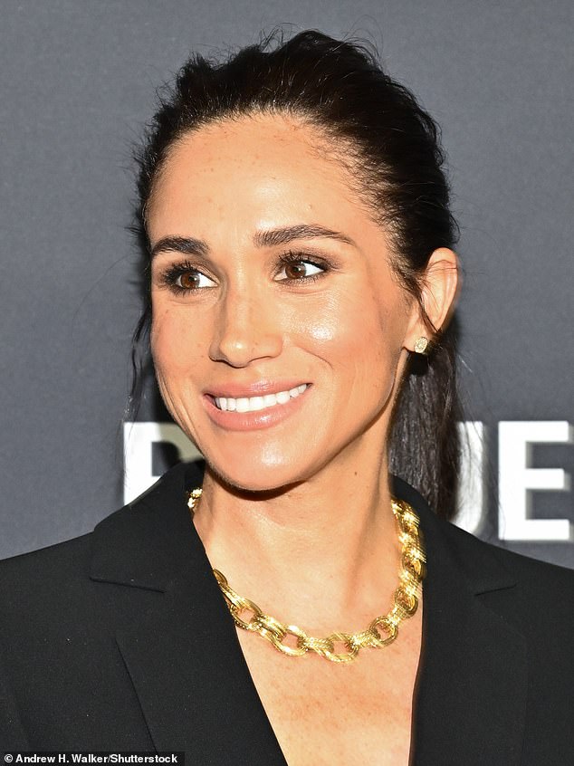 The Duchess of Sussex stuns with her chich attire and glam gold necklace as she graces the carpet ahead of the gala