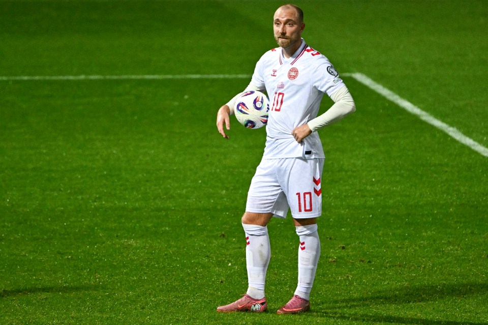 Denmark's midfielder Christian Eriksen holding a football during a VAR break.