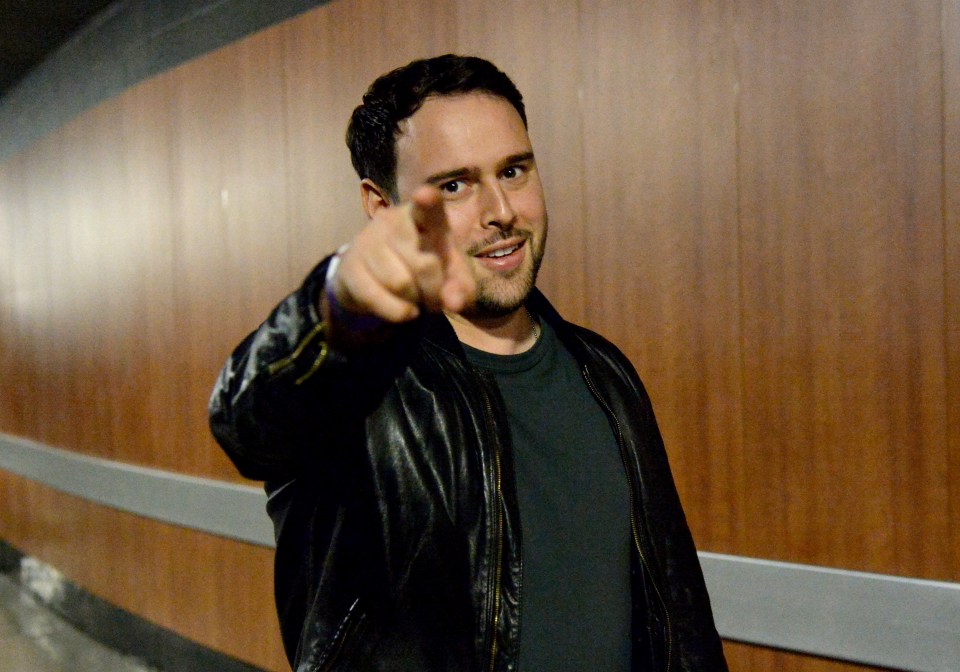 Talent manager Scooter Braun pointing his finger forward.