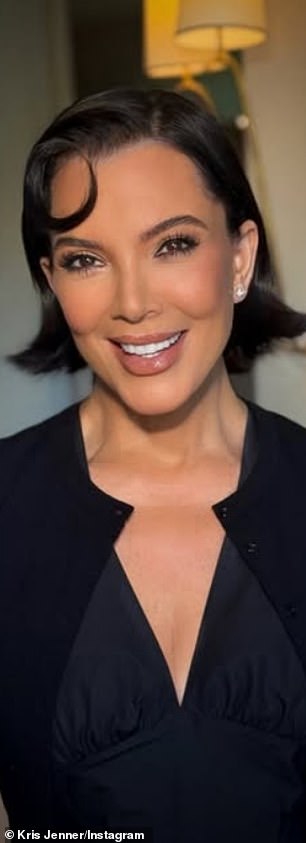 Pictured with her signature raven-hued hair