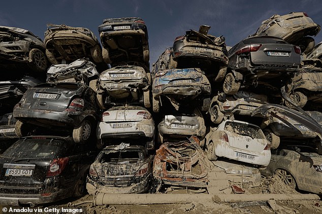 The catastrophe sparked public fury over warning systems and the emergency response. Pictured: A view of wrecked cars stored in a junkyard outside Paiporta after they were damaged by flooding in Valencia, Spain on November 10, 2024