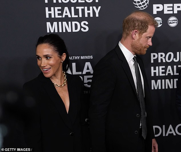 The Duchess of Sussex also gave a sideways smile during a tactile display by the couple