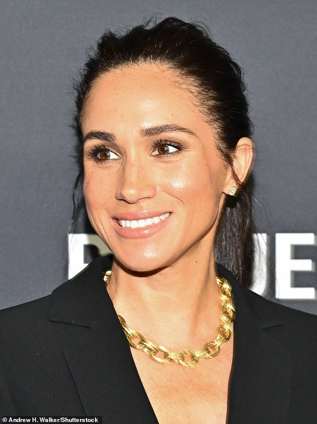 The Duchess of Sussex beamed in front of the cameras