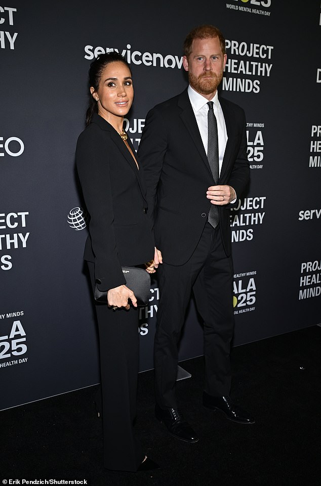 The duo clasped each others hands tightly as they posed for pictures on the carpet ahead of the award ceremony