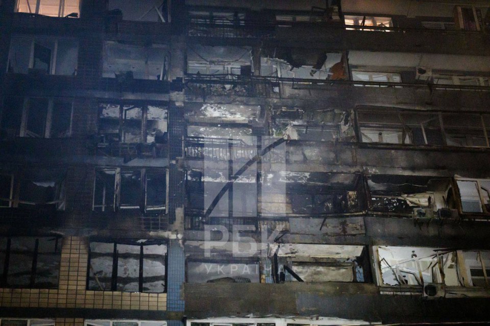 Charred and damaged building facade after a strike.
