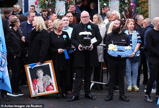 Mourners outside the Cheshire Cheese pub - Hatton's local - on Stockport Road in Hyde