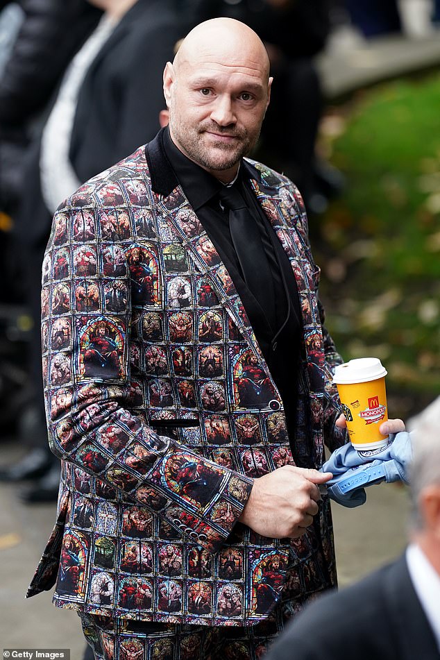 Fury's brash, attention-grabbing suit also featured images of him and his wife Paris