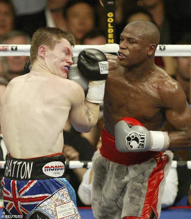 Hatton takes a punch from Floyd Mayweather. That brutal defeat in 2007 led to mental health struggles for 'The Hitman'