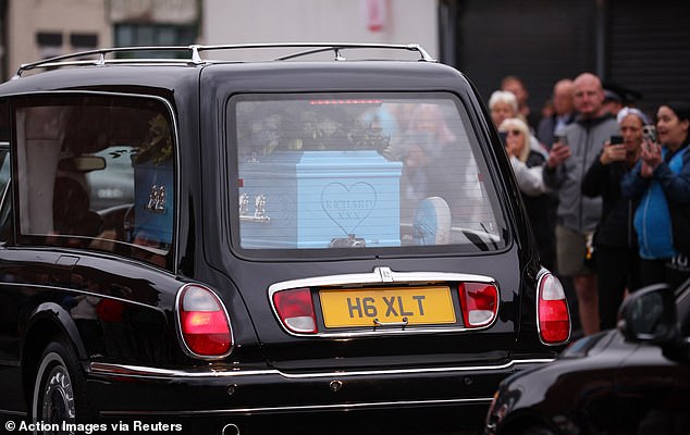 Hatton's body was in a blue coffin with 'Blue Moon' etched on the side today