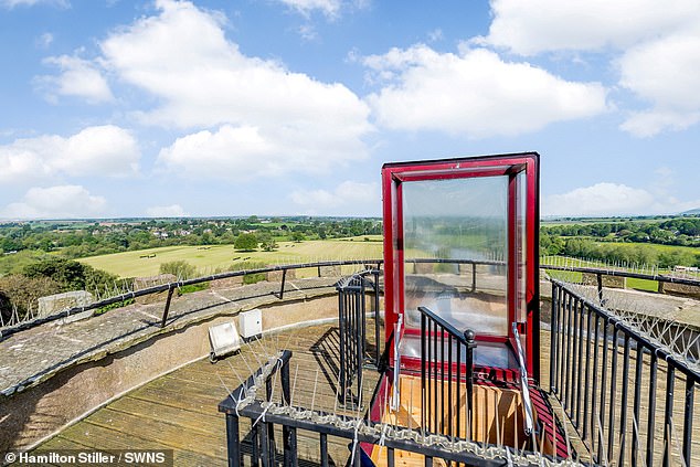 The Grade II-listed turret (pictured, its roof terrace), which is in the Gothic Revival style, dates back to the 19th century, built as a viewing tower along with the walls in 1833