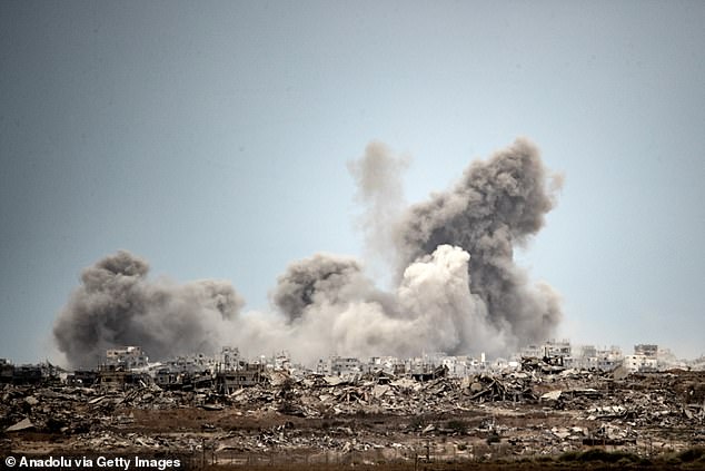 Pictured: Smoke rises in the Gaza Strip following Israeli airstrikes on October 9