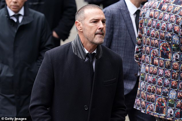 Meanwhile, comedian Paddy, 52, donned a long black coat over an all-black suit
