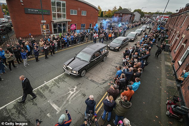The funeral cortege of Ricky Hatton passes his boxing gym in his hometown of Hyde today