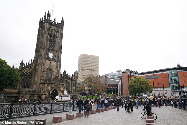 Memebers of the public gather outside Manchester Cathedral ahead of the funeral today