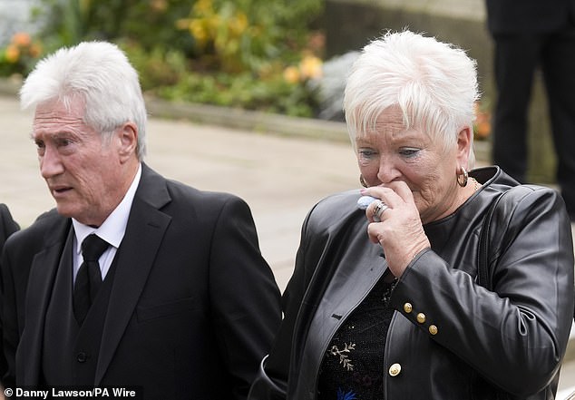 Ricky Hatton's parents Carol and Ray arrive at Manchester Cathedral for the service today