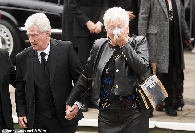 Ricky Hatton's parents Carol and Ray arrive at Manchester Cathedral for the service today
