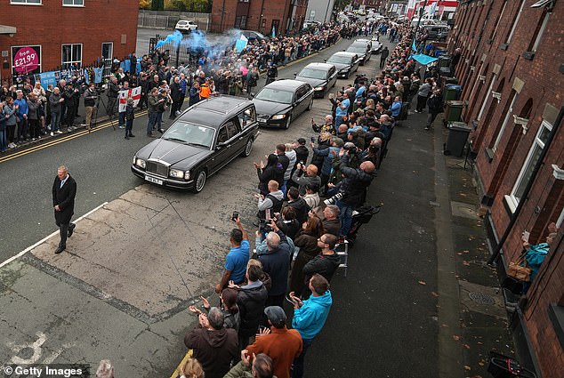 The funeral cortege of Ricky Hatton passes his boxing gym in his hometown of Hyde today
