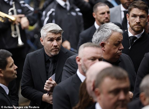 Boxers and brothers Callum Smith and Liam Smith arrive to attend the funeral
