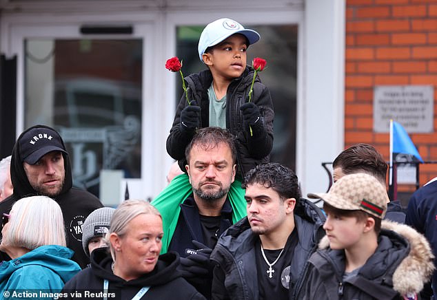 Mourners outside the Cheshire Cheese in Hyde today as Ricky Hatton's funeral takes place