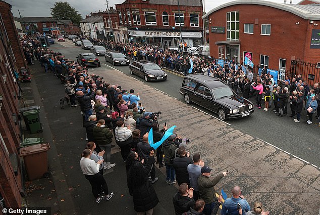 The funeral cortege of Ricky Hatton passes his boxing gym in his hometown of Hyde today