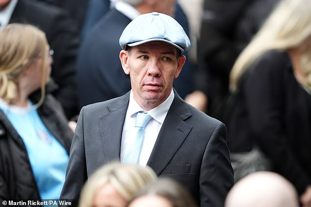 Boxing coach Nigel Travis arrives ahead of the funeral service for Ricky Hatton today