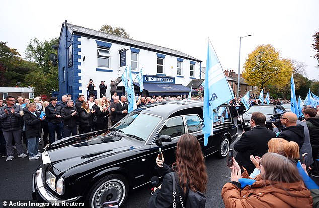 The cortege outside the Cheshire Cheese in Hyde today as Ricky Hatton's funeral takes place