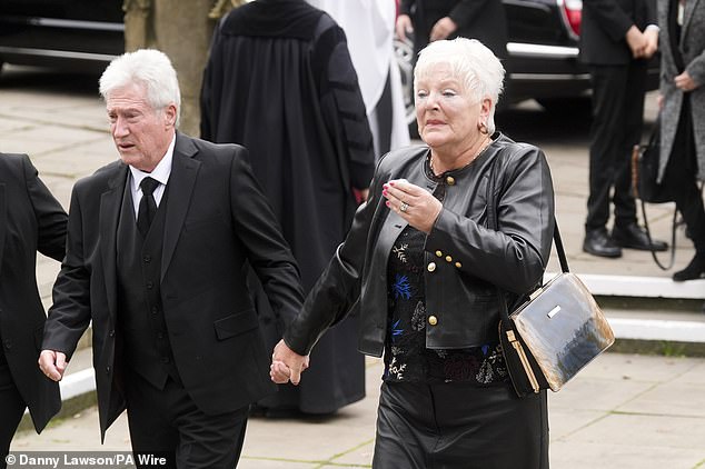 Ricky Hatton's parents Carol and Ray arrive at Manchester Cathedral for the service today